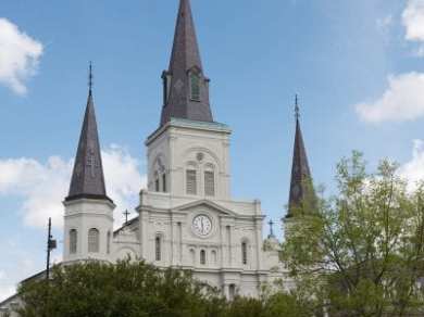 a close up of a church with St. Louis Cathedral in the background
