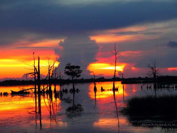 a sunset over a body of water