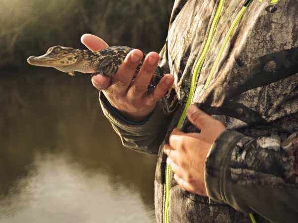 a man holding an animal