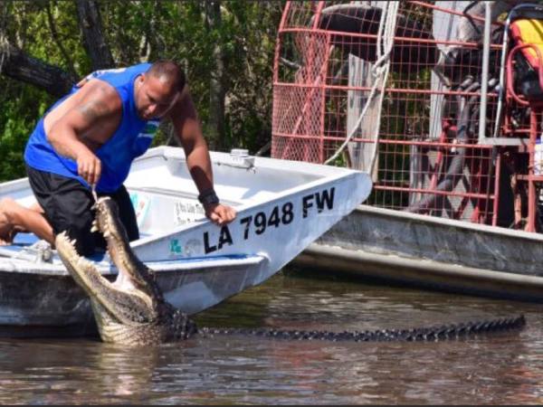 a man riding on the back of a boat
