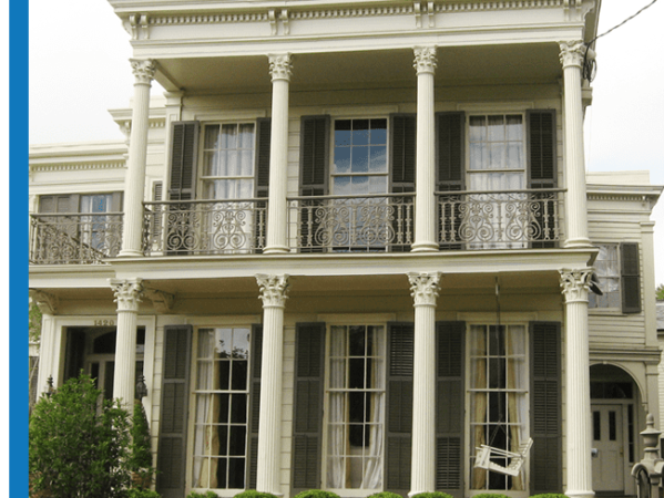 a large building with Garden District in the background